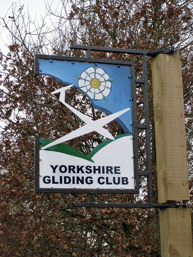 Sign for the Yorkshire Gliding Club. If memory serves, the sign was different in 1987. © Copyright Pauline E and licensed for reuse under the Creative Commons License